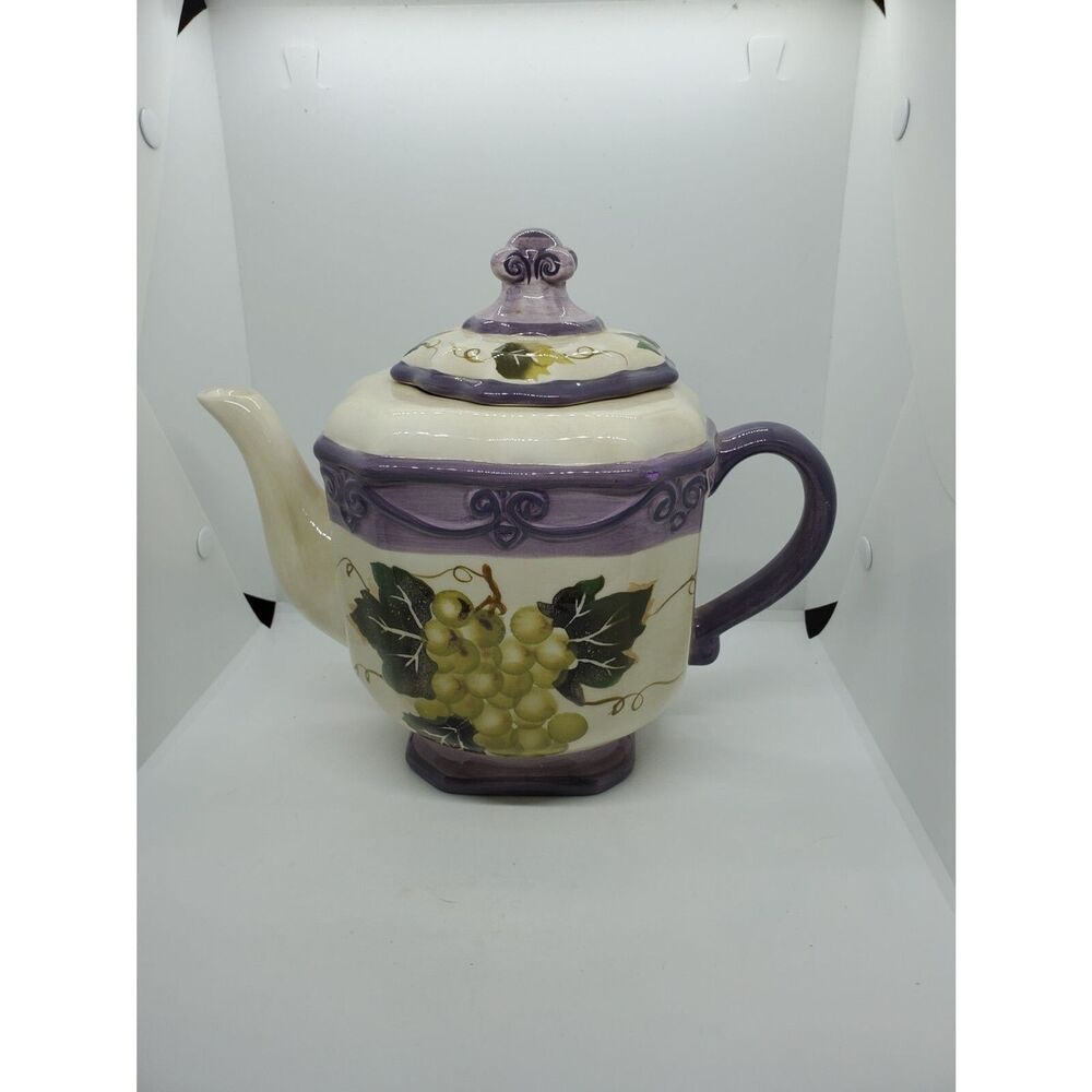This is a Merlot Teapot Hand painted by Tabletops Unlimited